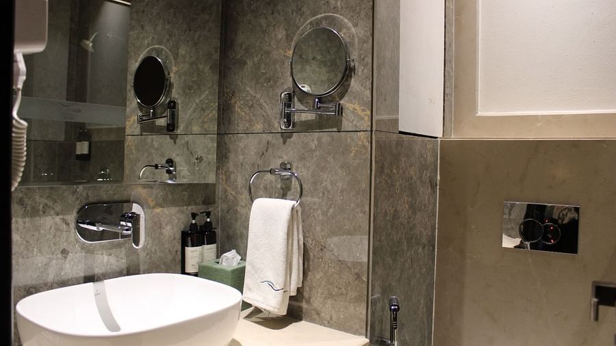 A bathroom featuring washbasin and a face mirror at BluSalzz Residence, Amritsar.